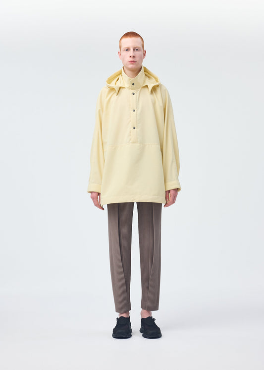A model wears the HOMME PLISSÉ ISSEY MIYAKE PADDED RIM SHIRT shirt.