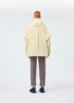 A model wears the HOMME PLISSÉ ISSEY MIYAKE PADDED RIM SHIRT shirt.