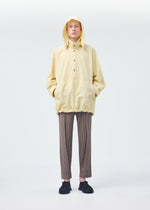 A model wears the HOMME PLISSÉ ISSEY MIYAKE PADDED RIM SHIRT shirt.