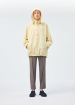 A model wears the HOMME PLISSÉ ISSEY MIYAKE PADDED RIM SHIRT shirt.