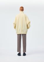 A model wears the HOMME PLISSÉ ISSEY MIYAKE PADDED RIM SHIRT shirt.