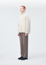 A model wears the HOMME PLISSÉ ISSEY MIYAKE MONTHLY COLORS SEPTEMBER jacket.