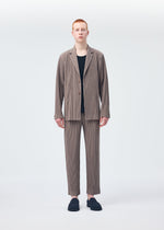 A model wears the HOMME PLISSÉ ISSEY MIYAKE TAILORED PLEATS 1 jacket.