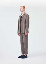 A model wears the HOMME PLISSÉ ISSEY MIYAKE TAILORED PLEATS 1 jacket.