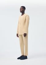 A model wears the HOMME PLISSÉ ISSEY MIYAKE TAILORED PLEATS 2 clothing.