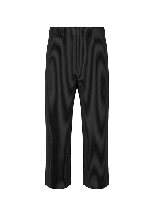 A product shot of the HOMME PLISSÉ ISSEY MIYAKE MONTHLY COLORS AUGUST trousers in black (15).