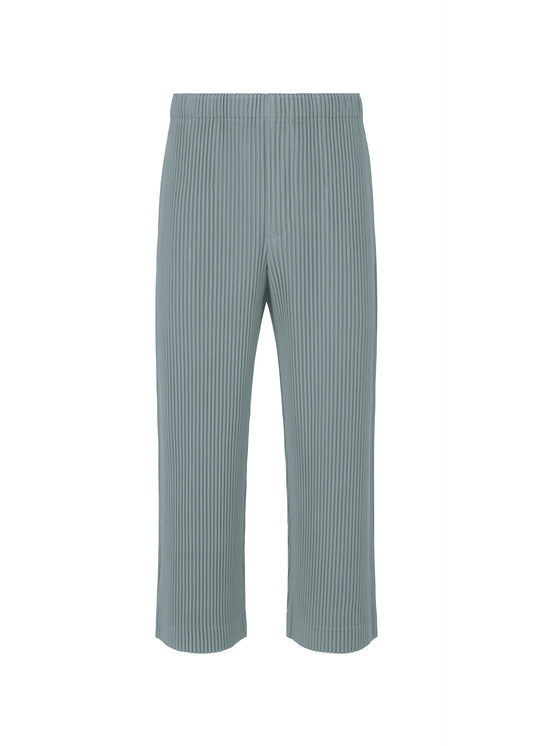 A product shot of the HOMME PLISSÉ ISSEY MIYAKE MONTHLY COLORS AUGUST trousers in slate blue (71).