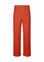 A product shot of the HOMME PLISSÉ ISSEY MIYAKE MONTHLY COLORS SEPTEMBER trousers in jasper red (25).