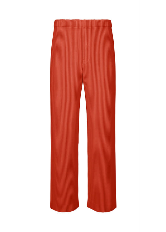 A product shot of the HOMME PLISSÉ ISSEY MIYAKE MONTHLY COLORS SEPTEMBER trousers in jasper red (25).