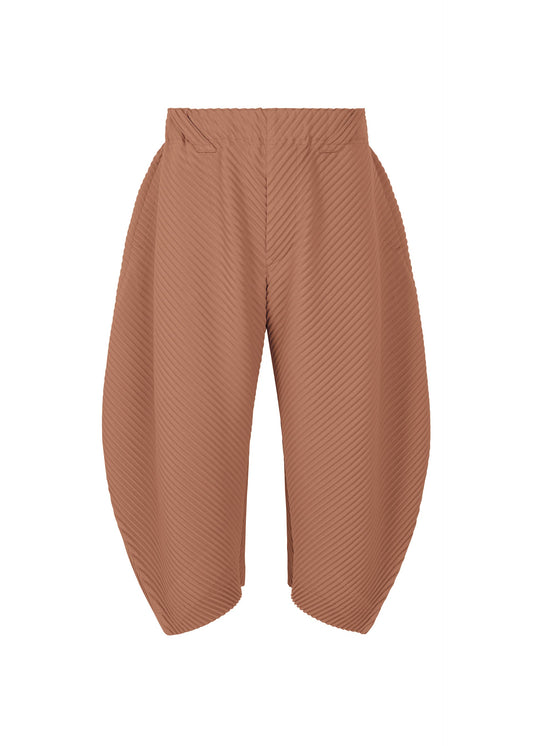 A product shot of the HOMME PLISSÉ ISSEY MIYAKE PLEATS BOTTOMS 1 trousers in vanadinite red (26).