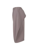 A detail shot of the HOMME PLISSÉ ISSEY MIYAKE PLEATS BOTTOMS 1 trousers.