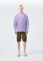A model wears the HOMME PLISSÉ ISSEY MIYAKE PLEATS BOTTOMS 2 clothing.
