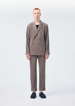 A model wears the HOMME PLISSÉ ISSEY MIYAKE TAILORED PLEATS 1 trousers.
