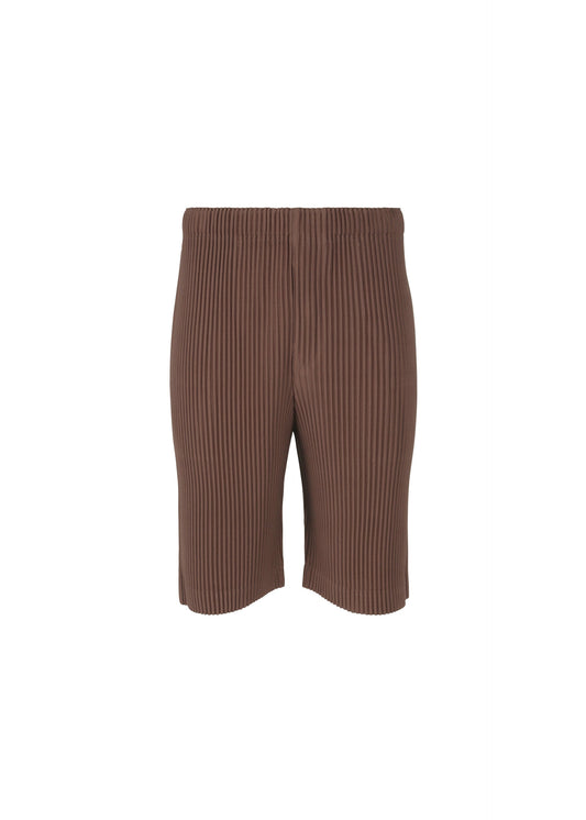 A product shot of the HOMME PLISSÉ ISSEY MIYAKE COLOR PLEATS trousers in edge brown (48).