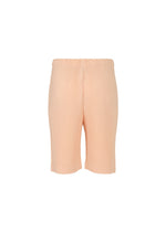 A detail shot of the HOMME PLISSÉ ISSEY MIYAKE COLOR PLEATS trousers.