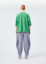 A model wears the HOMME PLISSÉ ISSEY MIYAKE ANGULAR STONE trousers.