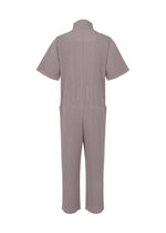 A detail shot of the HOMME PLISSÉ ISSEY MIYAKE PLEATS BOTTOMS 1 jumpsuit.