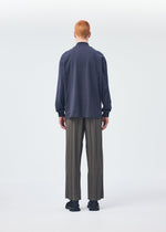 A model wears the HOMME PLISSÉ ISSEY MIYAKE Black Turtleneck Top top.