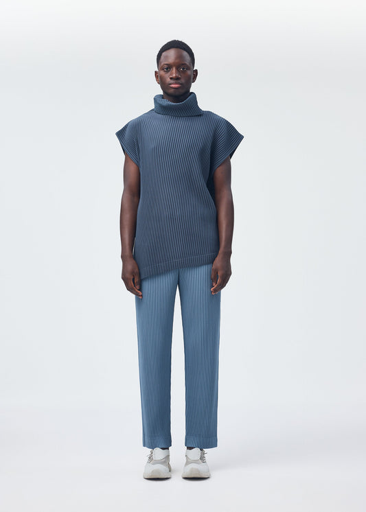A model wears the HOMME PLISSÉ ISSEY MIYAKE ANGULAR STONE top.