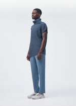 A model wears the HOMME PLISSÉ ISSEY MIYAKE ANGULAR STONE top.