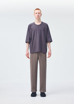 A model wears the HOMME PLISSÉ ISSEY MIYAKE RELEASE T 1 top.