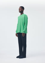 A model wears the HOMME PLISSÉ ISSEY MIYAKE RELEASE T 1 top.