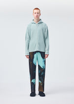 A model wears the HOMME PLISSÉ ISSEY MIYAKE MONTHLY COLORS JULY shirt.