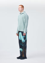 A model wears the HOMME PLISSÉ ISSEY MIYAKE MONTHLY COLORS JULY shirt.