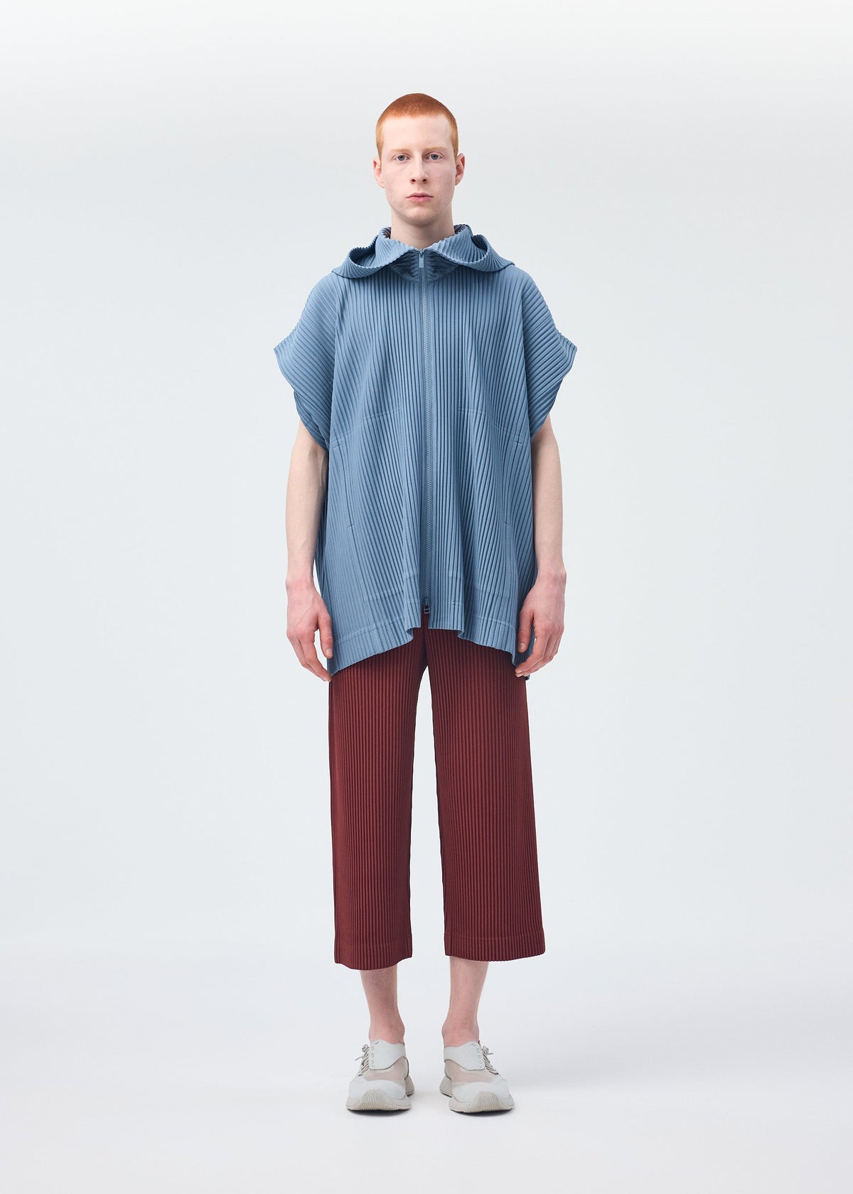 A model wears the HOMME PLISSÉ ISSEY MIYAKE MONTHLY COLORS AUGUST shirt.
