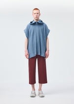 A model wears the HOMME PLISSÉ ISSEY MIYAKE MONTHLY COLORS AUGUST shirt.