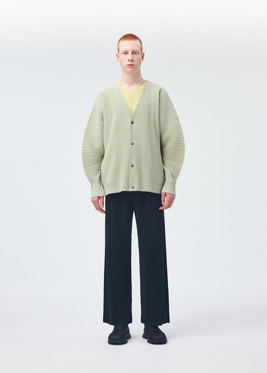 A model wears the HOMME PLISSÉ ISSEY MIYAKE MONTHLY COLORS OCTOBER shirt.