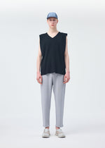 A model wears the HOMME PLISSÉ ISSEY MIYAKE BASIC KNIT trousers.