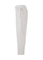 A detail shot of the HOMME PLISSÉ ISSEY MIYAKE BASIC KNIT trousers.