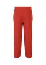 A detail shot of the HOMME PLISSÉ ISSEY MIYAKE RUSTIC KNIT trousers.