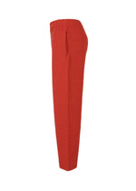 A detail shot of the HOMME PLISSÉ ISSEY MIYAKE RUSTIC KNIT trousers.