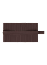 A product shot of the HOMME PLISSÉ ISSEY MIYAKE PLEATS BAND cap in aubergine black (18).