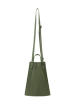 A detail shot of the HOMME PLISSÉ ISSEY MIYAKE DRAWSTRING PLEATS BAG bag.