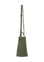 A detail shot of the HOMME PLISSÉ ISSEY MIYAKE DRAWSTRING PLEATS BAG bag.