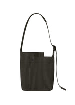 A product shot of the HOMME PLISSÉ ISSEY MIYAKE UTILITY bag in pizza scorch brown (46).