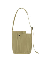 A product shot of the HOMME PLISSÉ ISSEY MIYAKE UTILITY bag in cinque terre rock green grey (68).