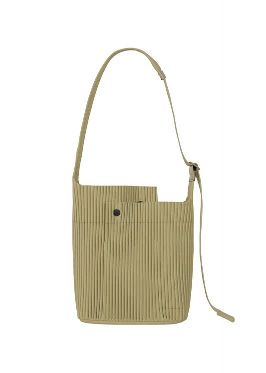 A product shot of the HOMME PLISSÉ ISSEY MIYAKE UTILITY bag in cinque terre rock green grey (68).