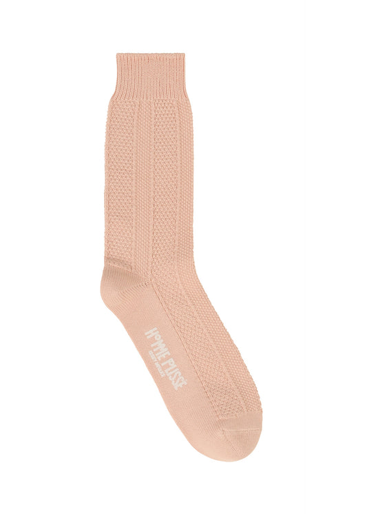 A detail shot of the HOMME PLISSÉ ISSEY MIYAKE STEM SOCKS lingerie & hosiery.