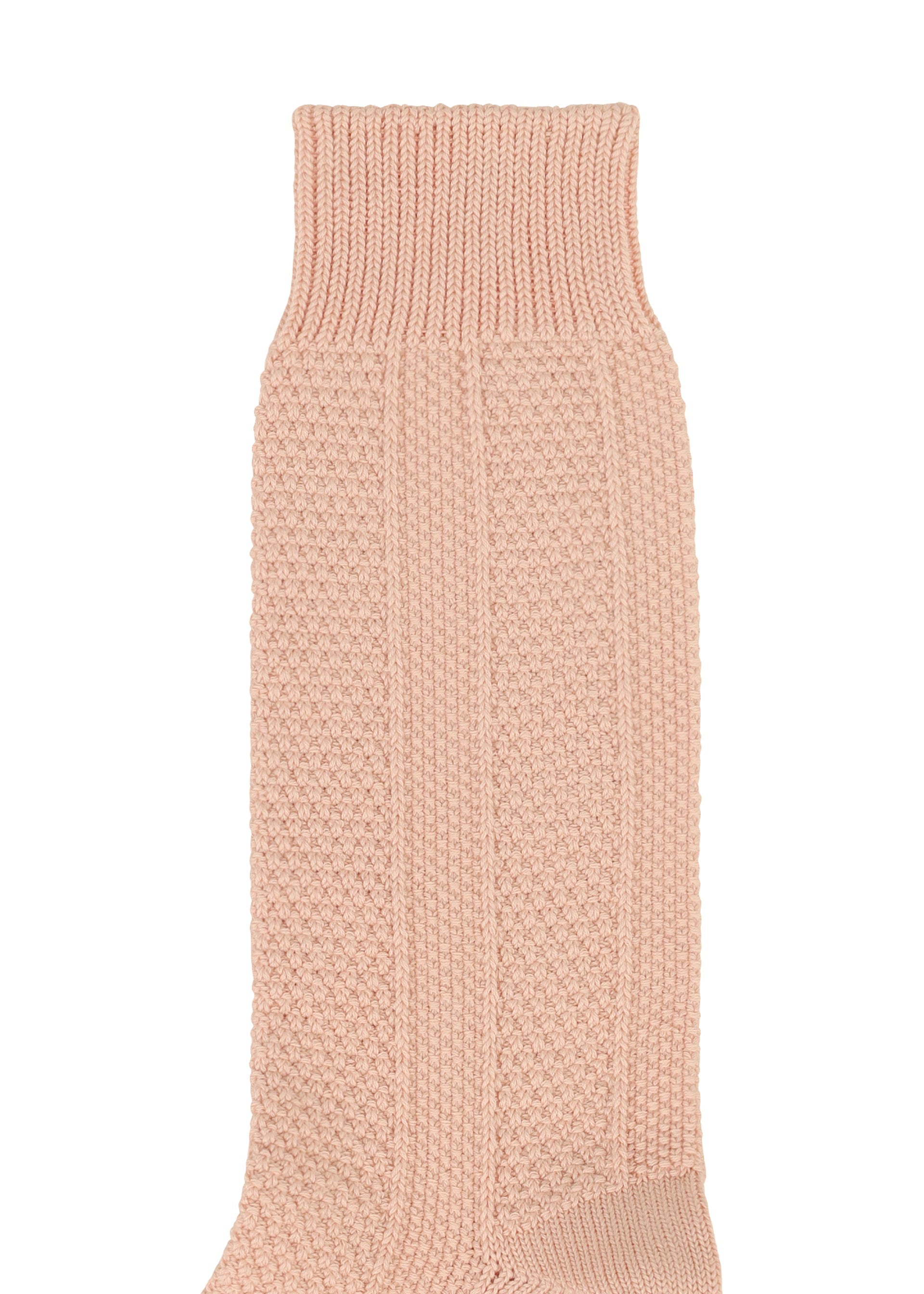 A detail shot of the HOMME PLISSÉ ISSEY MIYAKE STEM SOCKS lingerie & hosiery.