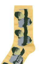 A detail shot of the HOMME PLISSÉ ISSEY MIYAKE DAWN SOCKS socks.