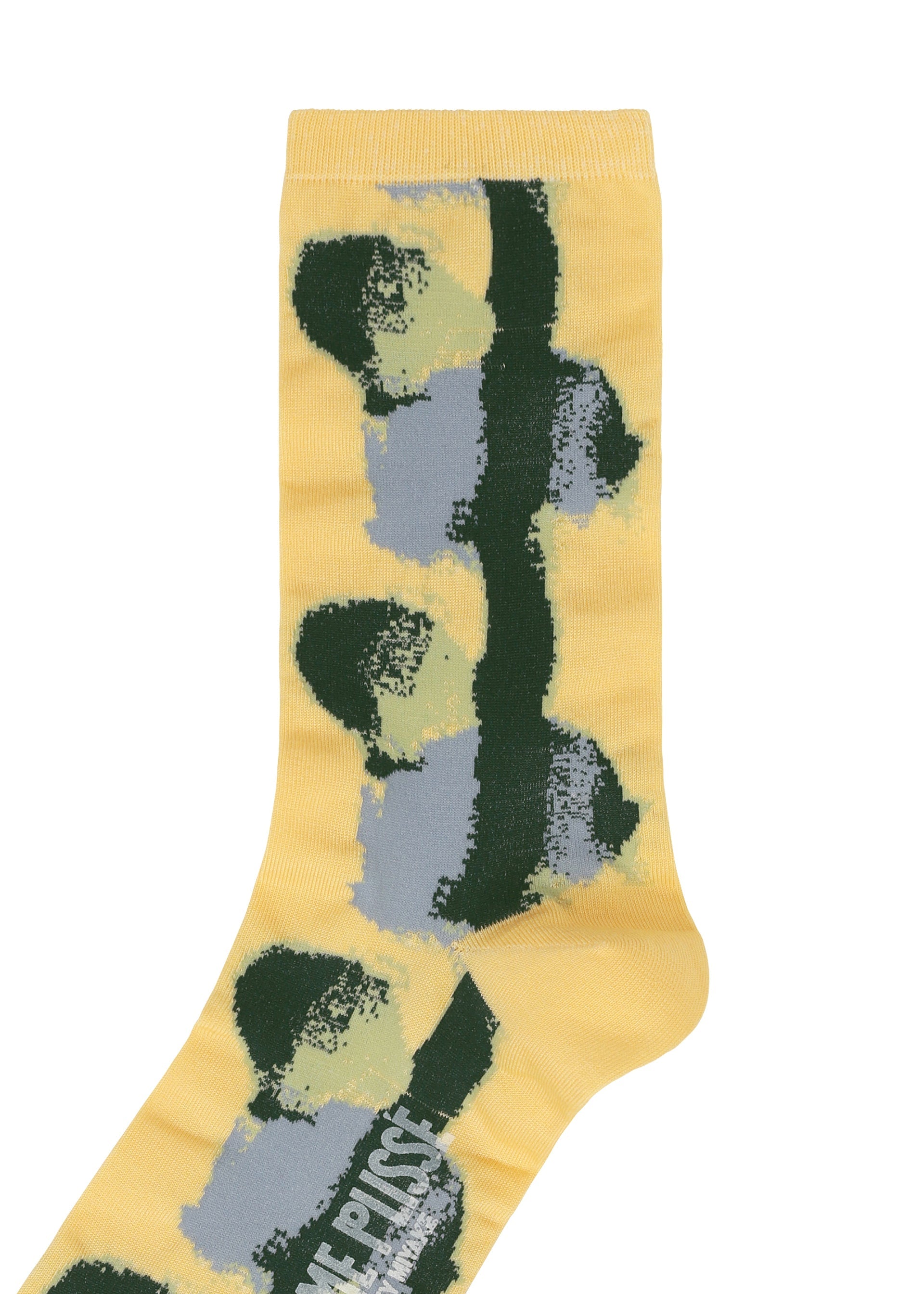 A detail shot of the HOMME PLISSÉ ISSEY MIYAKE DAWN SOCKS socks.