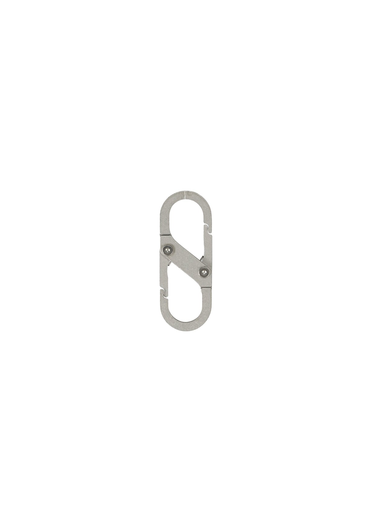 A detail shot of the HOMME PLISSÉ ISSEY MIYAKE CARABINER jewellery.
