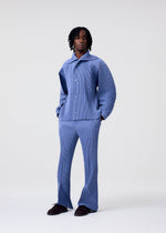 A model wears the HOMME PLISSÉ ISSEY MIYAKE LINEN LIKE jacket.