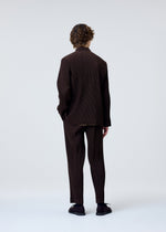 A model wears the HOMME PLISSÉ ISSEY MIYAKE TUXEDO PLEATS jacket.