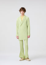 A model wears the HOMME PLISSÉ ISSEY MIYAKE LINEN LIKE jacket.