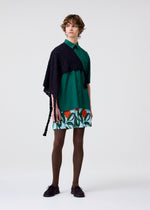 A model wears the HOMME PLISSÉ ISSEY MIYAKE PL RAMIE SHIRT shirt.